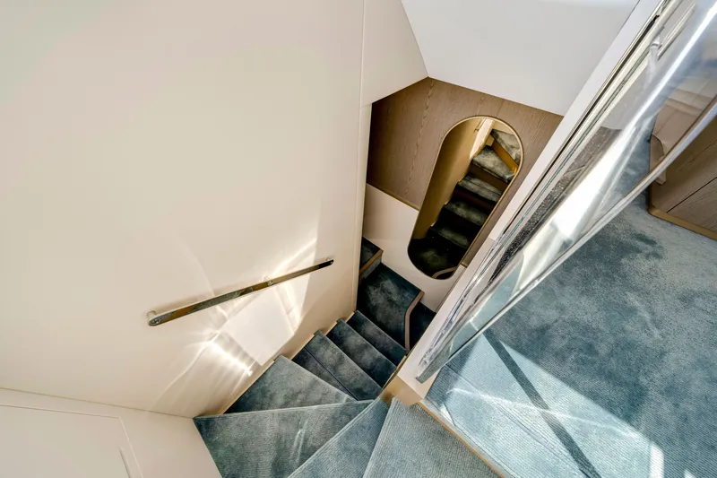 Slide: The Image of Interior of a 2024 Azimut Magellano with elegant staircase and modern design. - 30