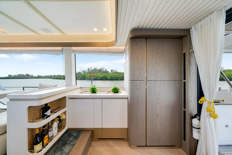 Slide: The Image of Interior of a 2024 Azimut Magellano with a modern kitchen and a view of the water. - 23