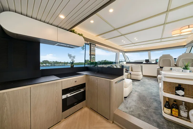 Slide: The Image of Interior of the 2024 Azimut Magellano with a modern kitchen and stylish living area. - 21