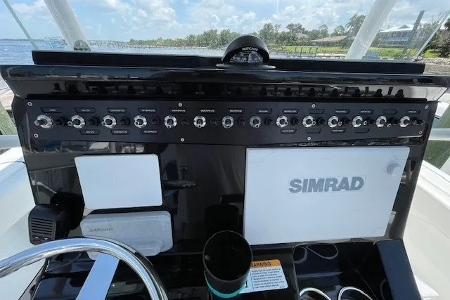 Slide: The Image of Control panel of 2023 Wellcraft 242 Fisherman boat with Simrad navigation system. - 27