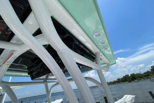 Slide: The Image of 2023 Wellcraft 242 Fisherman boat canopy with ocean view and clear blue sky. - 38
