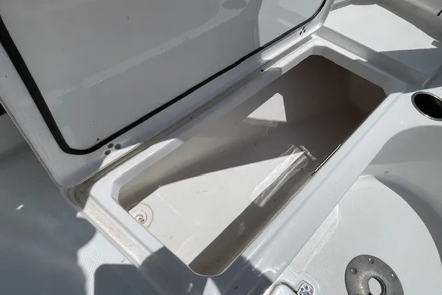 Slide: The Image of Open storage compartment on 2023 Wellcraft 242 Fisherman boat, showcasing interior space. - 65