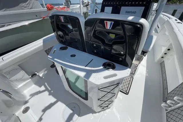 Slide: The Image of 2023 Wellcraft 242 Fisherman boat interior with seating and control panel. - 18