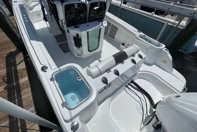 Slide: The Image of 2023 Wellcraft 242 Fisherman boat interior with seating and storage compartments. - 7