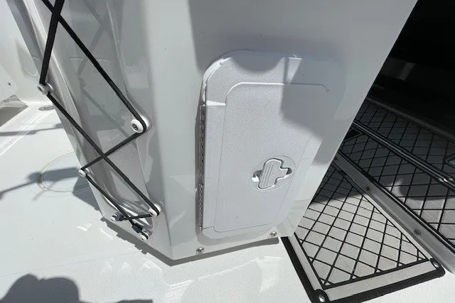 Slide: The Image of 2023 Wellcraft 242 Fisherman boat deck with storage compartment and netting. - 19