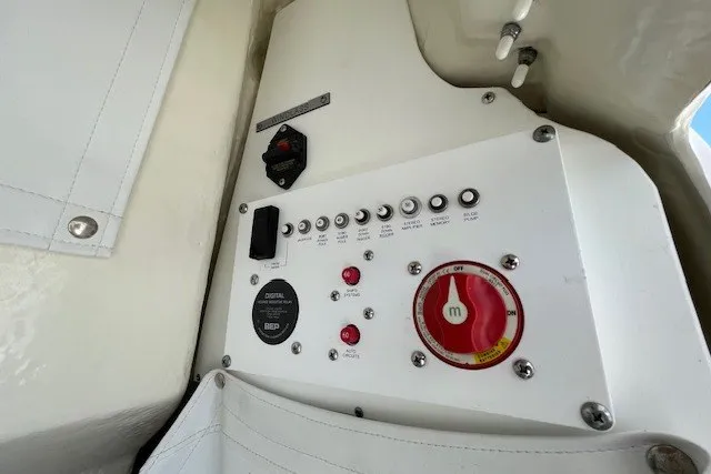 Slide: The Image of Control panel of 2023 Wellcraft 242 Fisherman boat with switches and indicators. - 52