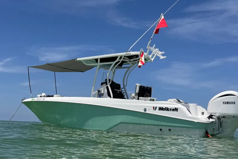 The Image of 2023 Wellcraft 242 Fisherman boat with Yamaha engine on calm water. - 0