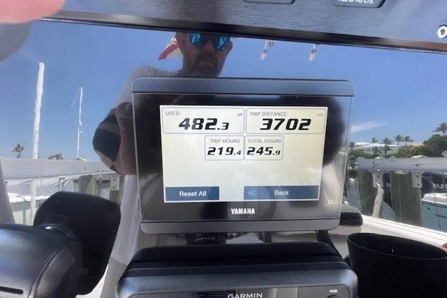 Slide: The Image of Yamaha display on 2023 Wellcraft 242 Fisherman showing fuel usage and trip distance. - 79