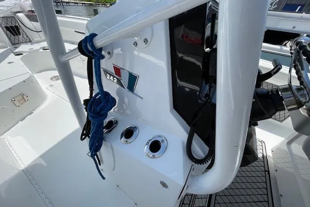 Slide: The Image of 2023 Wellcraft 242 Fisherman boat console with ropes and control panel. - 47