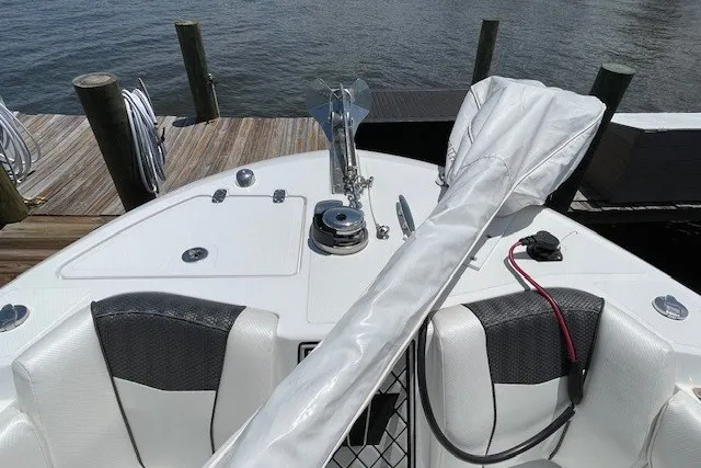 Slide: The Image of 2023 Wellcraft 242 Fisherman boat bow with anchor and seating at dock. - 67