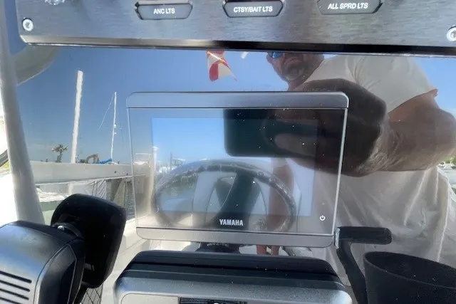 Slide: The Image of Dashboard of 2023 Wellcraft 242 Fisherman featuring Yamaha display and control buttons. - 40