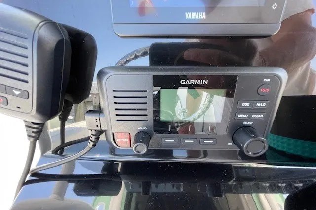 Slide: The Image of Garmin marine radio on 2023 Wellcraft 242 Fisherman boat dashboard. - 41
