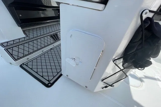 Slide: The Image of 2023 Wellcraft 242 Fisherman boat interior with storage compartment and non-slip flooring. - 21