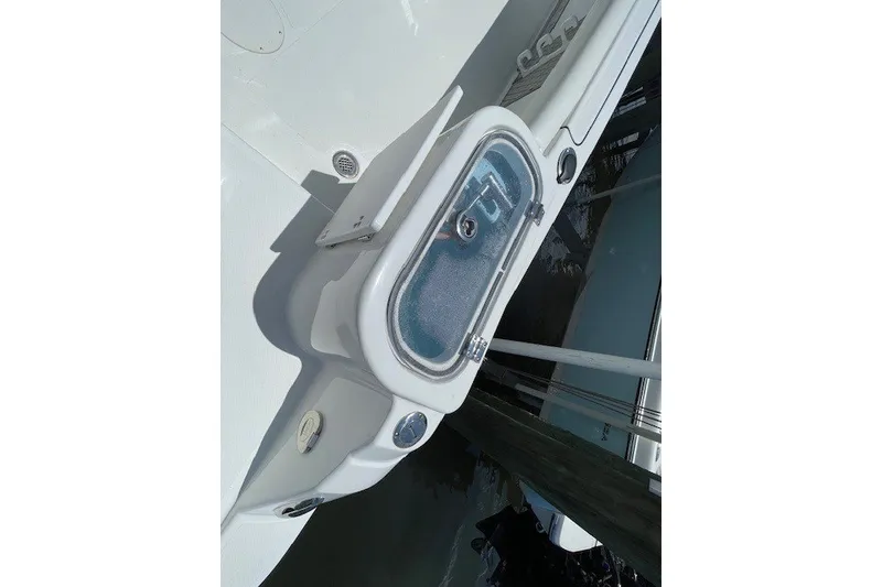 Slide: The Image of 2023 Wellcraft 242 Fisherman boat deck with storage compartment and sleek design. - 16