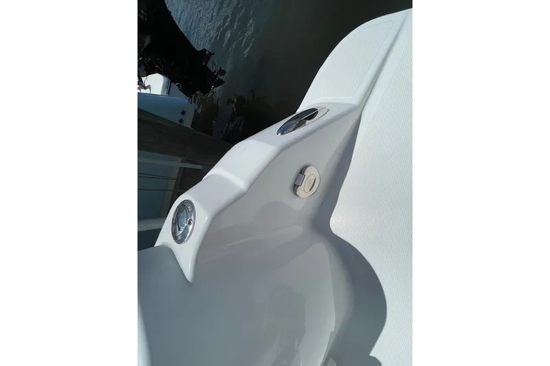 Slide: The Image of 2023 Wellcraft 242 Fisherman boat detail, featuring sleek white deck design. - 8