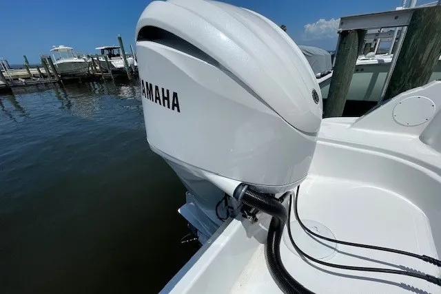 Slide: The Image of 2023 Wellcraft 242 Fisherman with Yamaha outboard motor docked at marina. - 5