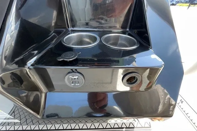 Slide: The Image of 2023 Wellcraft 242 Fisherman boat console with cup holders and USB ports. - 48