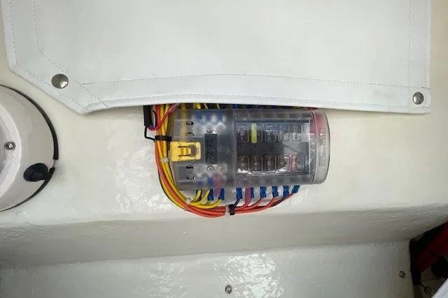 Slide: The Image of Electrical panel with colorful wiring on 2023 Wellcraft 242 Fisherman boat. - 54