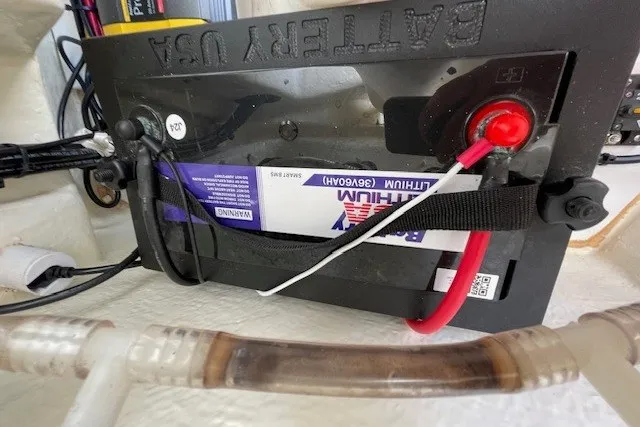 Slide: The Image of Battery compartment of 2023 Wellcraft 242 Fisherman boat with lithium battery installed. - 58
