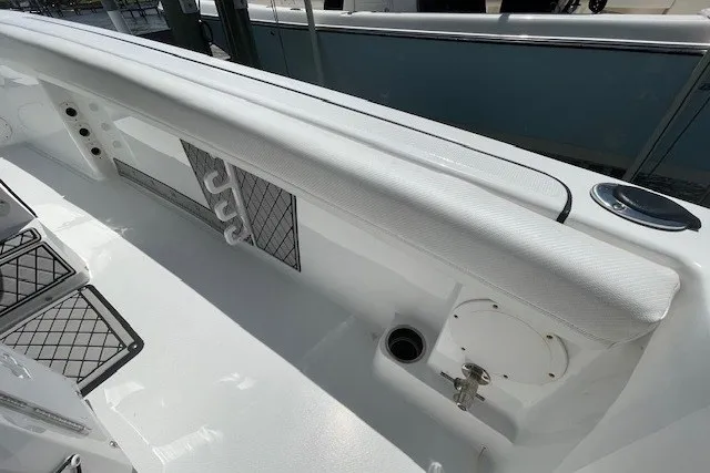Slide: The Image of 2023 Wellcraft 242 Fisherman boat interior with rod holders and storage compartments. - 24