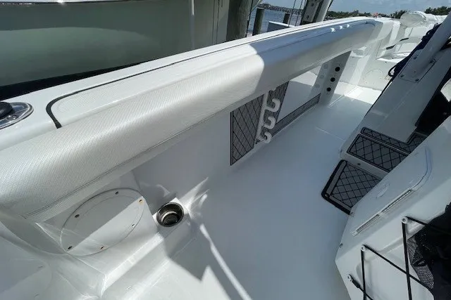 Slide: The Image of 2023 Wellcraft 242 Fisherman boat interior with sleek white design and storage compartments. - 23