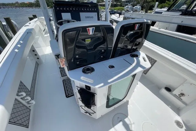 Slide: The Image of 2023 Wellcraft 242 Fisherman boat interior with dual seats and control panel. - 10