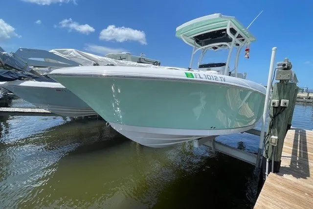 Slide: The Image of 2023 Wellcraft 242 Fisherman boat docked on a sunny day. - 3