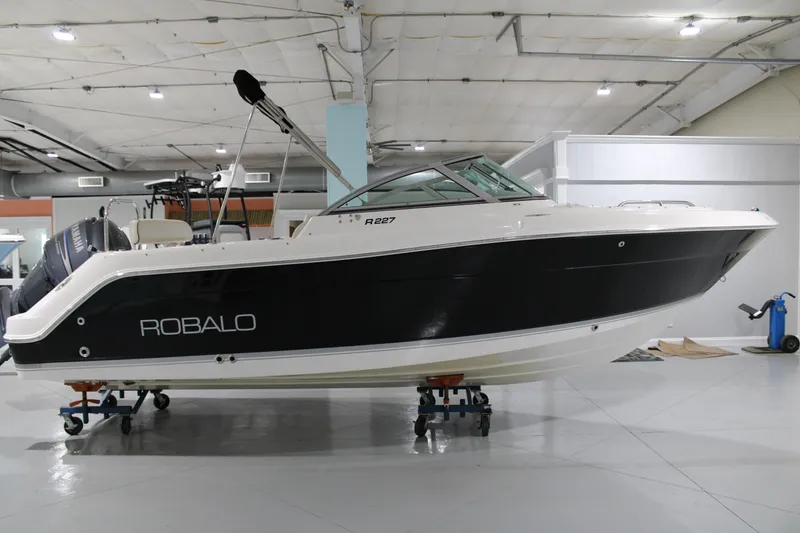 Slide: The Image of 2005 Robalo R227 Dual Console boat in indoor storage facility. - 5