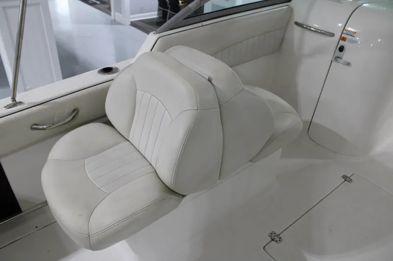 Slide: The Image of 2005 Robalo R227 Dual Console boat seat, white upholstery, interior view. - 13