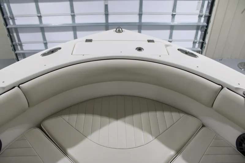 Slide: The Image of 2005 Robalo R227 Dual Console boat interior with cushioned seating. - 33