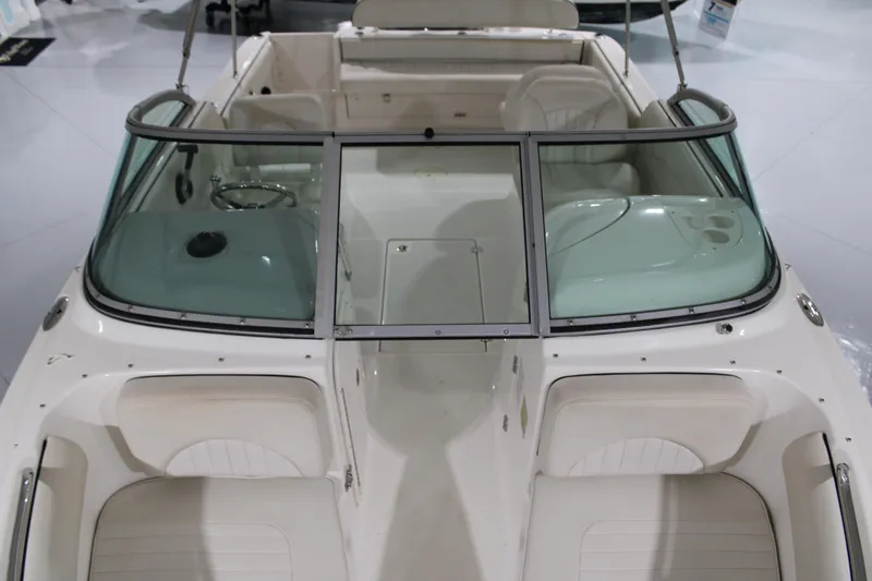 Slide: The Image of 2005 Robalo R227 Dual Console boat interior with seating and windshield. - 36