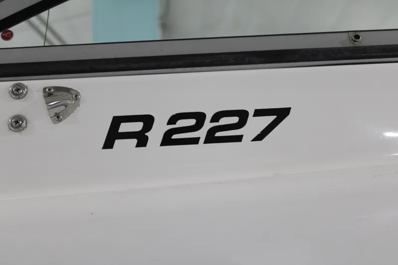 Slide: The Image of 2005 Robalo R227 Dual Console boat model lettering on hull. - 40