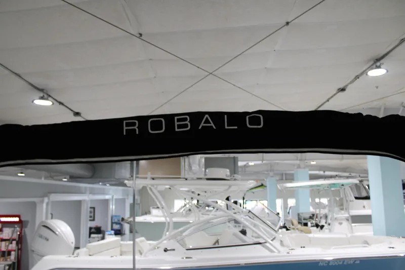 Slide: The Image of 2005 Robalo R227 Dual Console boat displayed indoors. - 38