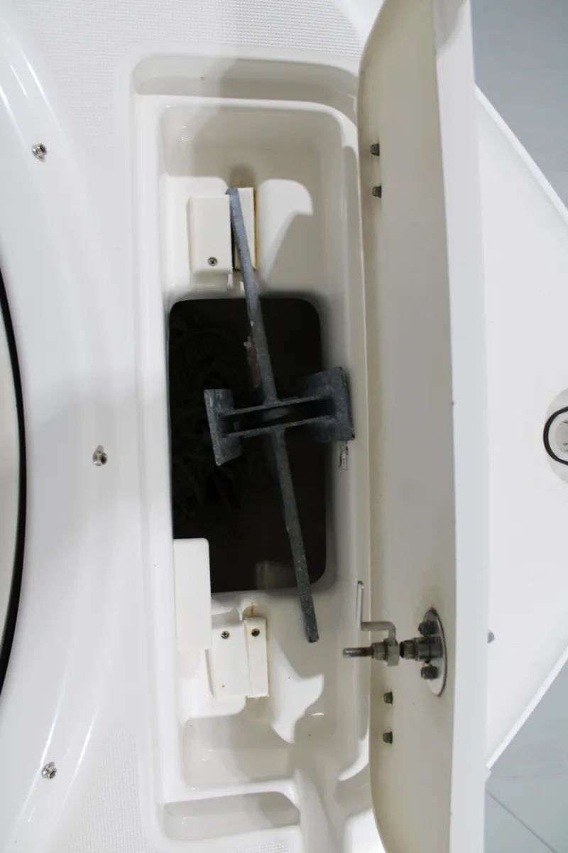 Slide: The Image of Anchor storage compartment on a 2005 Robalo R227 Dual Console boat. - 19