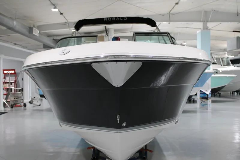 Slide: The Image of 2005 Robalo R227 Dual Console boat in showroom, front view. - 2