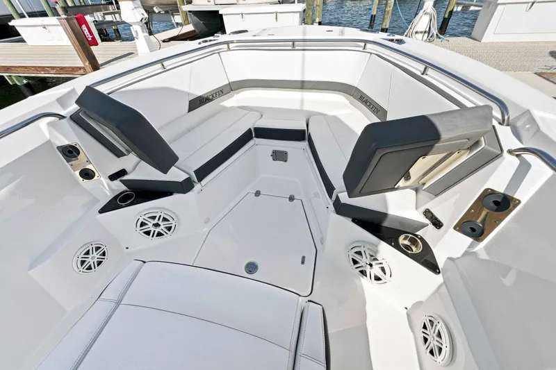 Slide: The Image of Interior view of a 2021 Blackfin 272 CC boat with seating and cup holders. - 21