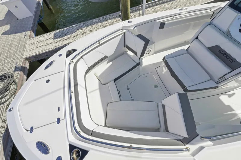Slide: The Image of 2021 Blackfin 272 CC boat interior with white cushioned seating and sleek design. - 20