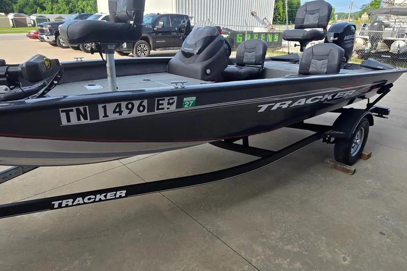 Slide: The Image of 2019 Tracker Pro Team 175 TF boat on trailer, parked outdoors. - 14