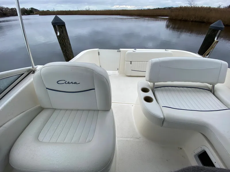 Slide: The Image of The image shows the cockpit of a 2002 Bayliner 2655 Ciera with white seating. - 6
