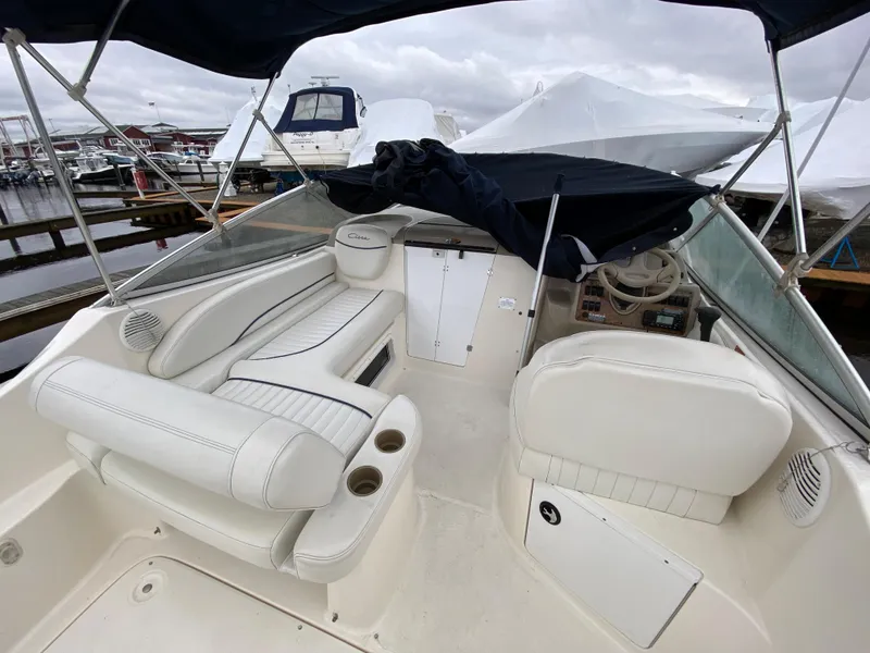 Slide: The Image of The image shows the cockpit of a 2002 Bayliner 2655 Ciera with white leather seats. - 7