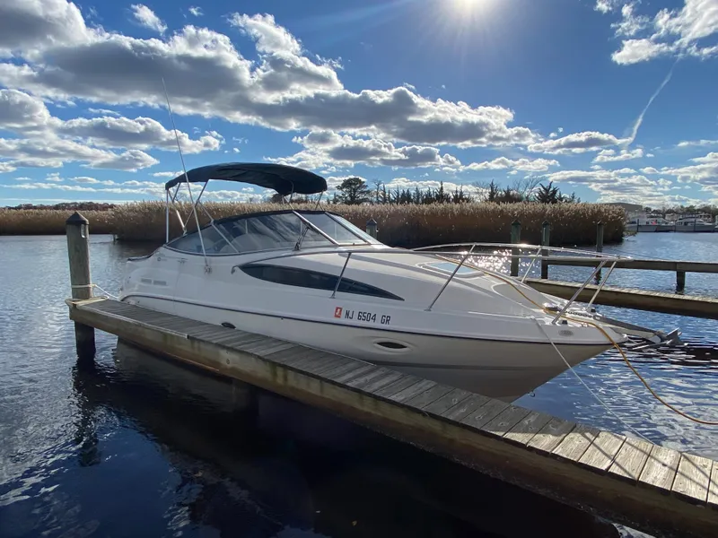 Slide: The Image of 2002 Bayliner 2655 Ciera docked on a sunny day. - 1