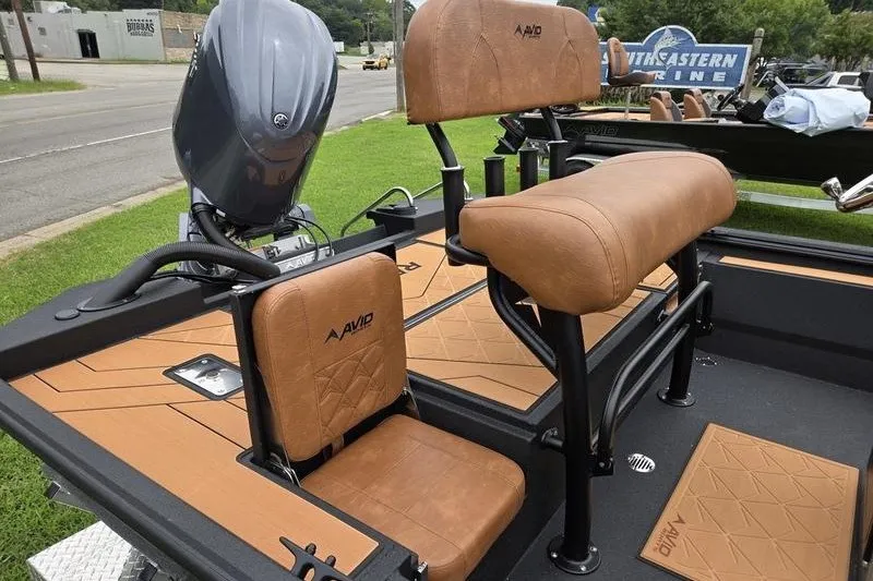Slide: The Image of Avid 207 Recon boat interior with tan seats and modern design, 2027 model. - 13