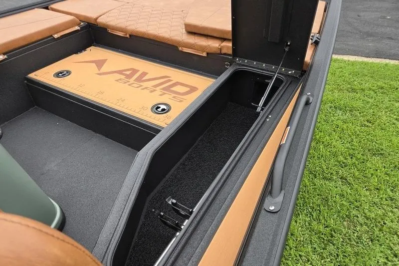 Slide: The Image of Interior view of 2027 Avid 207 Recon boat with storage compartments. - 15