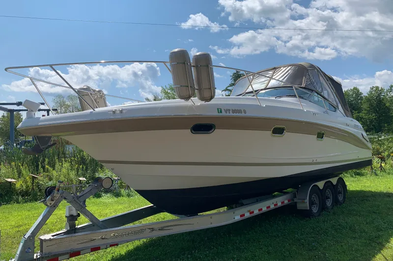 The Image of 2005 Four Winns 328 Vista boat on trailer under blue sky. - 3