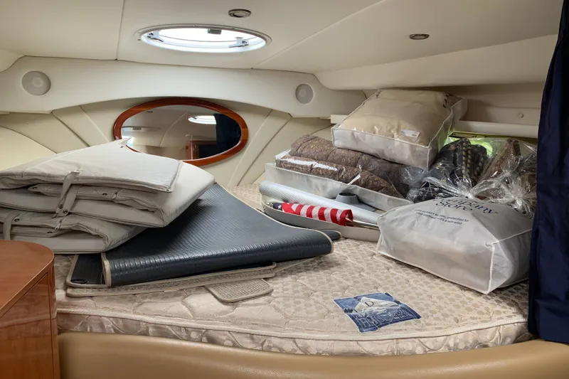 Slide: The Image of Interior cabin of 2005 Four Winns 328 Vista with bedding and cushions. - 22
