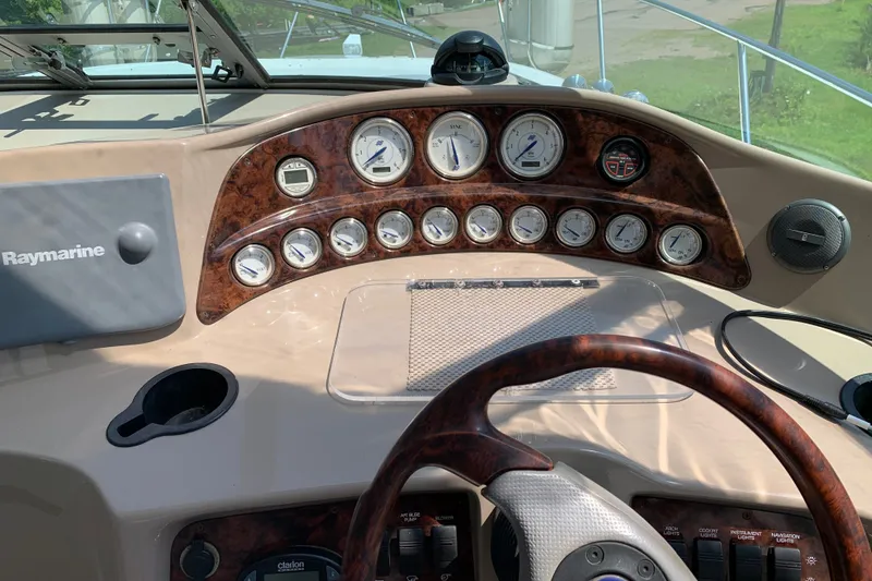 Slide: The Image of Dashboard of 2005 Four Winns 328 Vista boat with gauges and Raymarine equipment. - 17