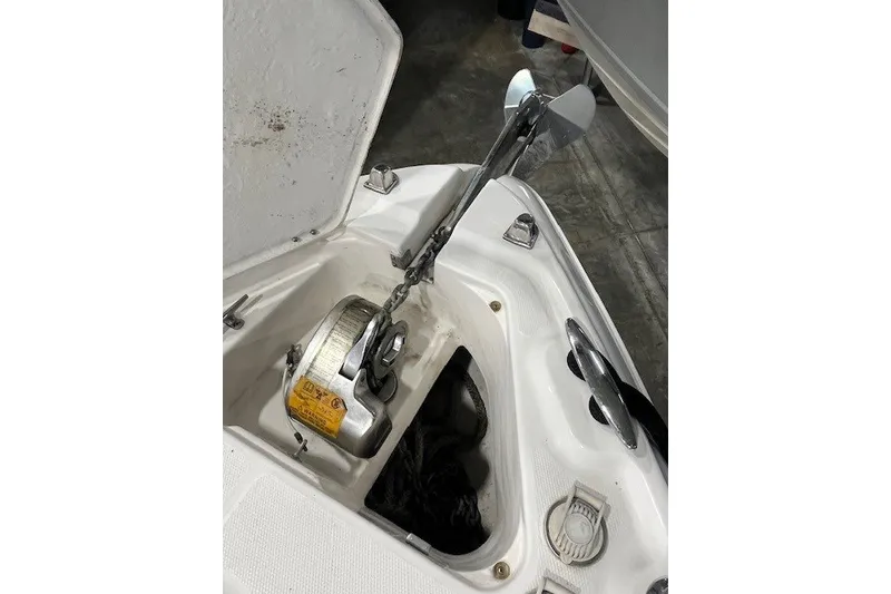 Slide: The Image of Anchor compartment of 2007 Chaparral Signature 280 boat with winch and chain. - 18
