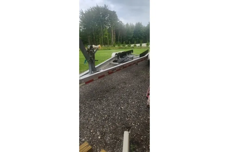 Slide: The Image of Trailer for 2007 Chaparral Signature 280 on gravel driveway, surrounded by greenery. - 23