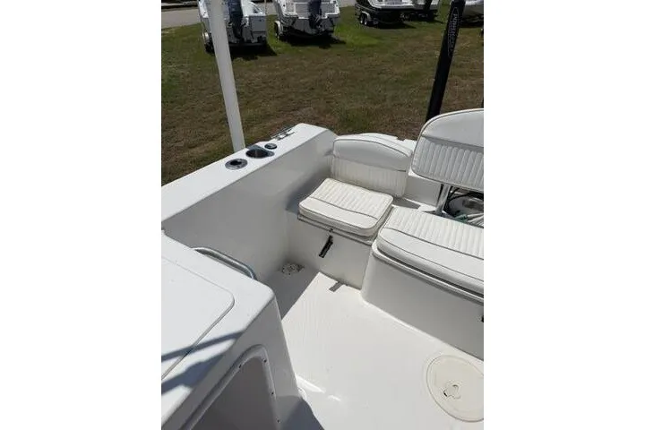 Slide: The Image of 2008 Sea Pro 228 Dual Console boat interior with white seating and cup holders. - 20