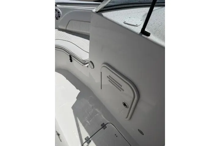 Slide: The Image of 2008 Sea Pro 228 Dual Console boat interior with seating and storage compartment. - 32